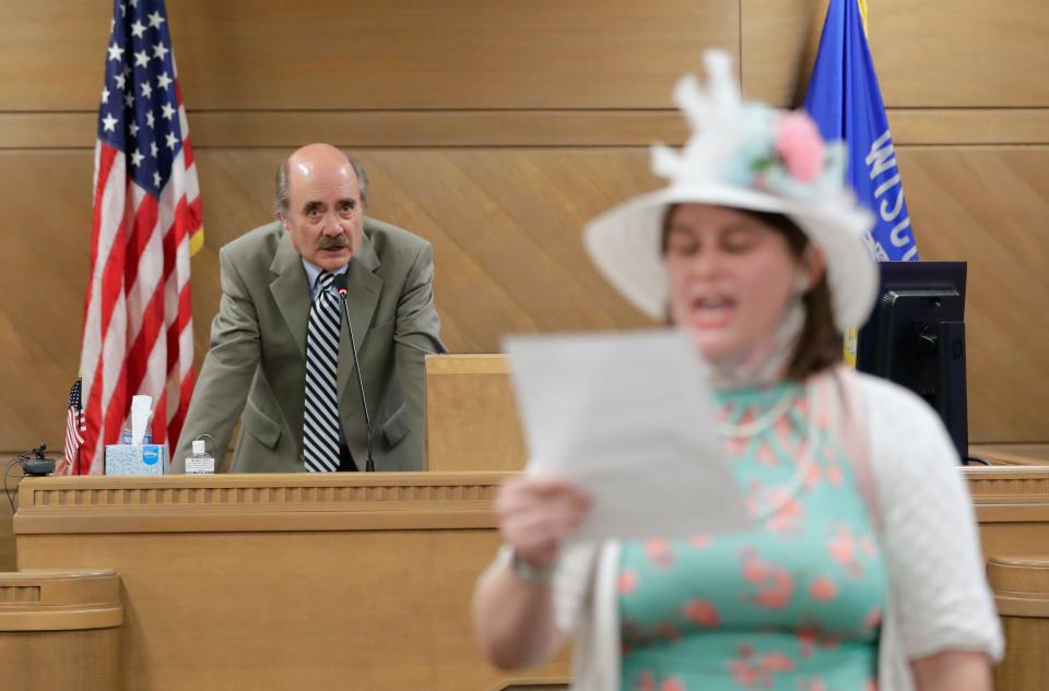 Outagamie County Board Chair Jeff Nooyen, left, asks deputies to remove a transgender rights activist from an Outagamie County Board meeting at the Outagamie County Government Center on Tuesday, May 23, 2023, in Appleton, Wis. At a May 9 county board meeting, board member Timothy Hermes made transphobic comments regarding transgender people and their use of bathrooms that align with their gender, calling them "disgusting."