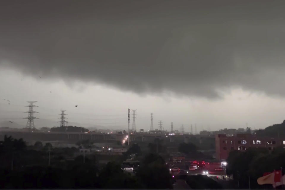 In this image taken from a video and released by Li Jiayi, storm clouds and strong wind are seen over the Baiyun district in the southern Chinese's city of Guangzhou on April 27, 2024. A tornado struck the southern Chinese city of Guangzhou on Saturday, killing some and damaging factory buildings, state media said. (Li Jiayi via AP)