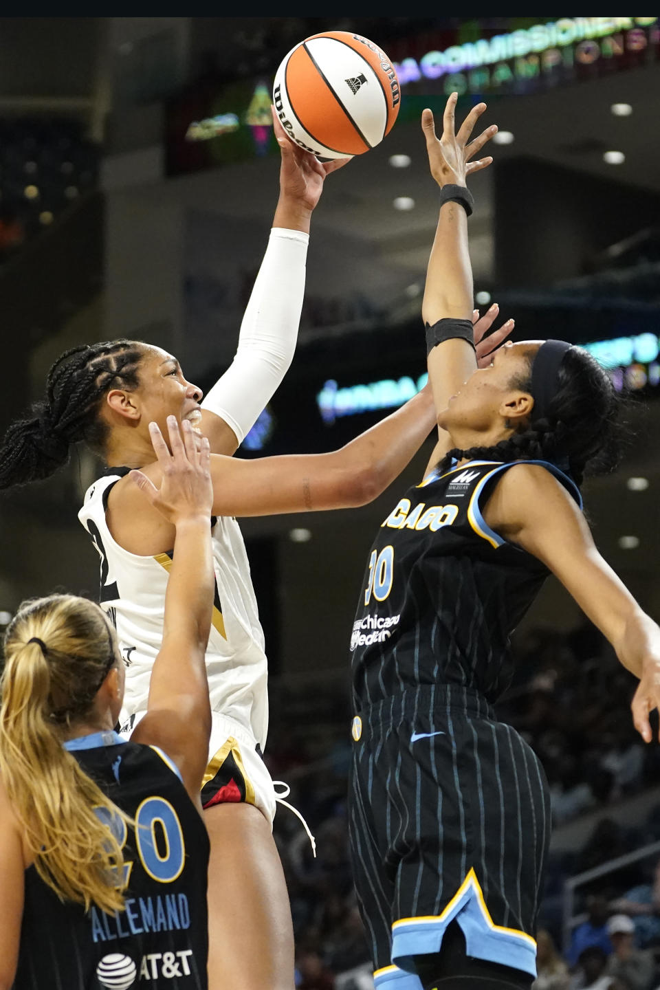 Las Vegas Aces' A'ja Wilson, left, shoots over Chicago Sky's Azura Stevens during the first half of the WNBA Commissioner's Cup basketball game Tuesday, July 26, 2022, in Chicago. (AP Photo/Charles Rex Arbogast)