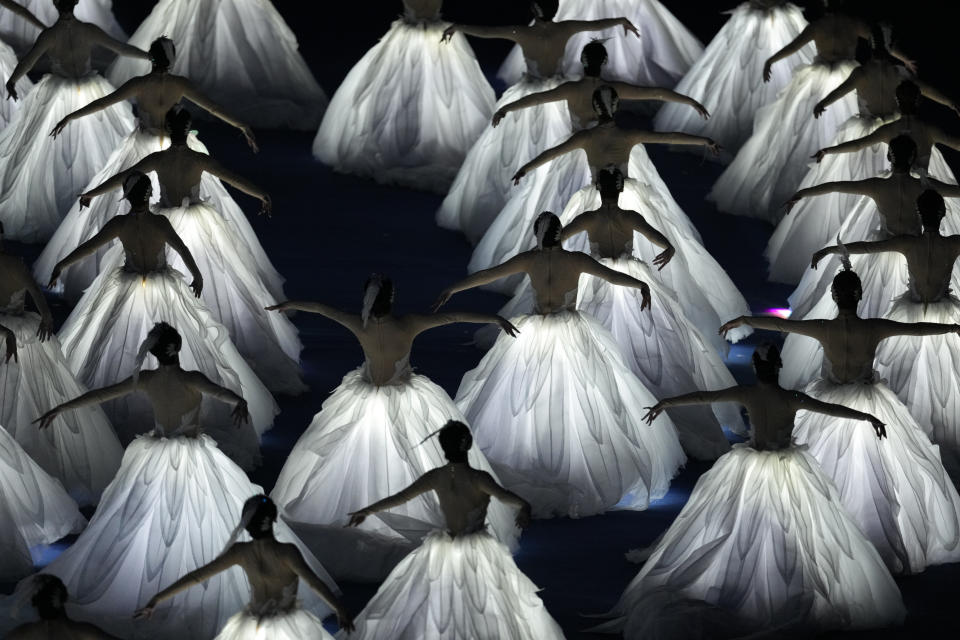 Artists perform during the opening ceremony of the 19th Asian Games in Hangzhou, China, Saturday, Sept. 23, 2023. (AP Photo/Eugene Hoshiko)