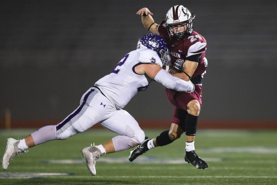 Calallen's Luke Medina (24) is tackled in a high school football playoff game against Boerne at Alamo Stadium in on Friday, Dec. 2, 2022 in San Antonio, Texas.