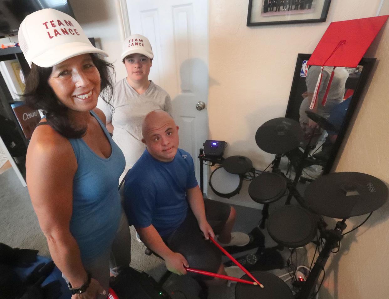 Lance Avery plays the drums for mom Anni Suadi and friend Rilea Jackson, Tuesday, Sept. 27, 2022.