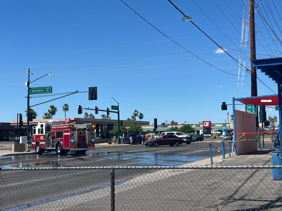 The scene of a three vehicle crash that caused a gas main to leak at the intersection of 27th and Northern Avenues on Monday.