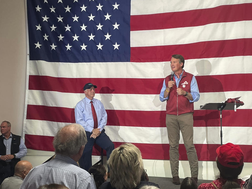 Virginia Gov. Glenn Youngkin, right, speaks at an event in support of Nevada Republican gubernatorial nominee Joe Lombardo, second from right, at the Nevada Trucking Association in Reno, Nev., Thursday, Sept. 15, 2022. (AP Photo/Gabe Stern)