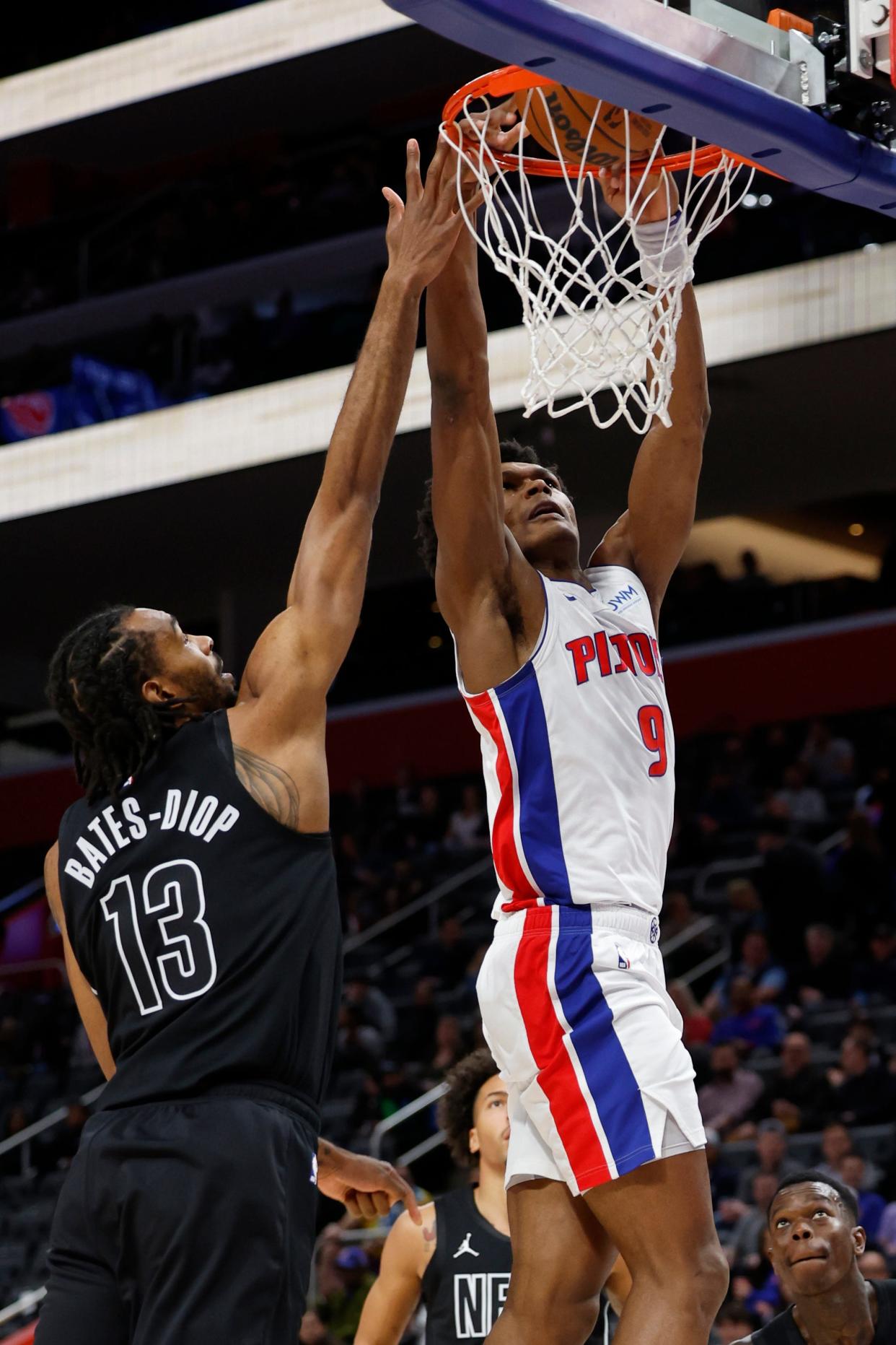 Detroit Pistons forward Ausar Thompson (9) dunks on Brooklyn Nets forward Keita Bates-Diop (13) in the first half at Little Caesars Arena in Detroit on Thursday, March 7, 2024.