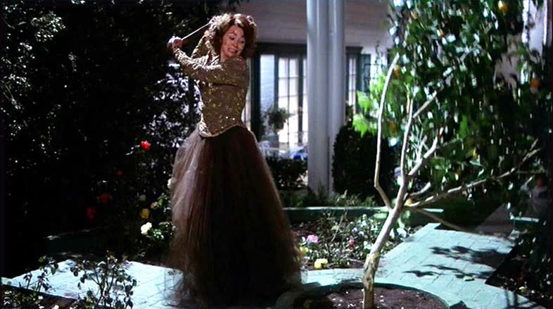 Joan Crawford take an axe to a tree in the middle of the night in Mommie Dearest. 