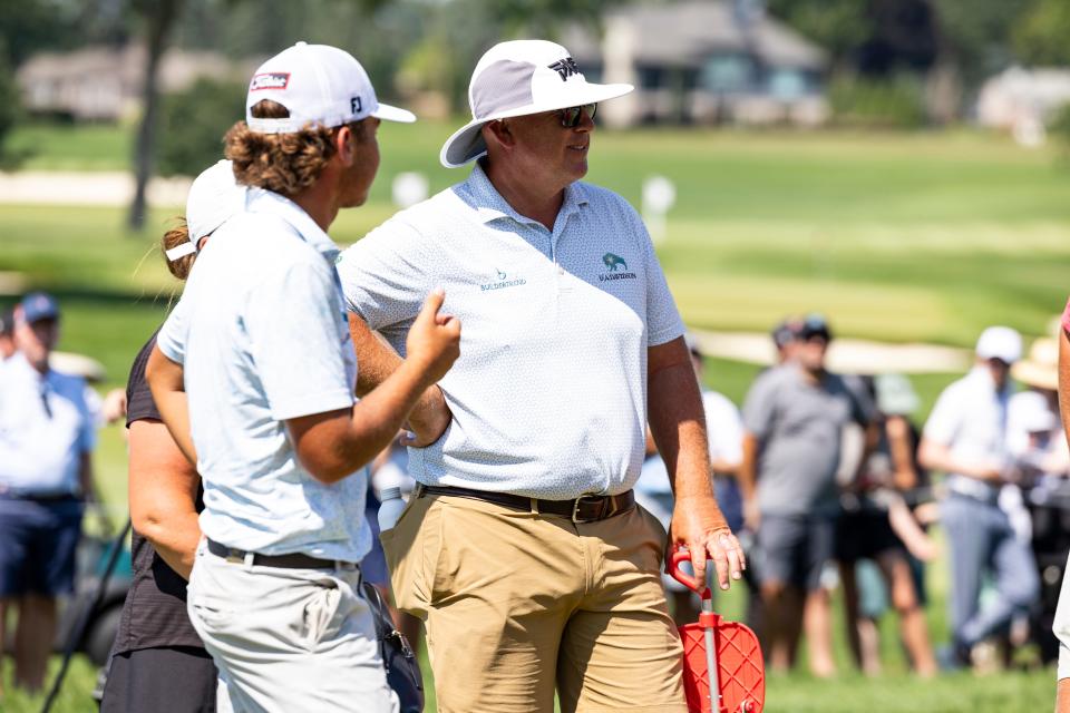 BLOOMFIELD HILLS, MICHIGAN - JULY 27: Trevor Gutschewski talks to his dad, Scott Gutschewski, after winning the Championship Match on day six of the 76th U.S. Junior Amateur Championship at Oakland Hills Country Club on July 27, 2024 in Bloomfield Hills, Michigan. (Photo by Lauren Leigh Bacho/Getty Images)