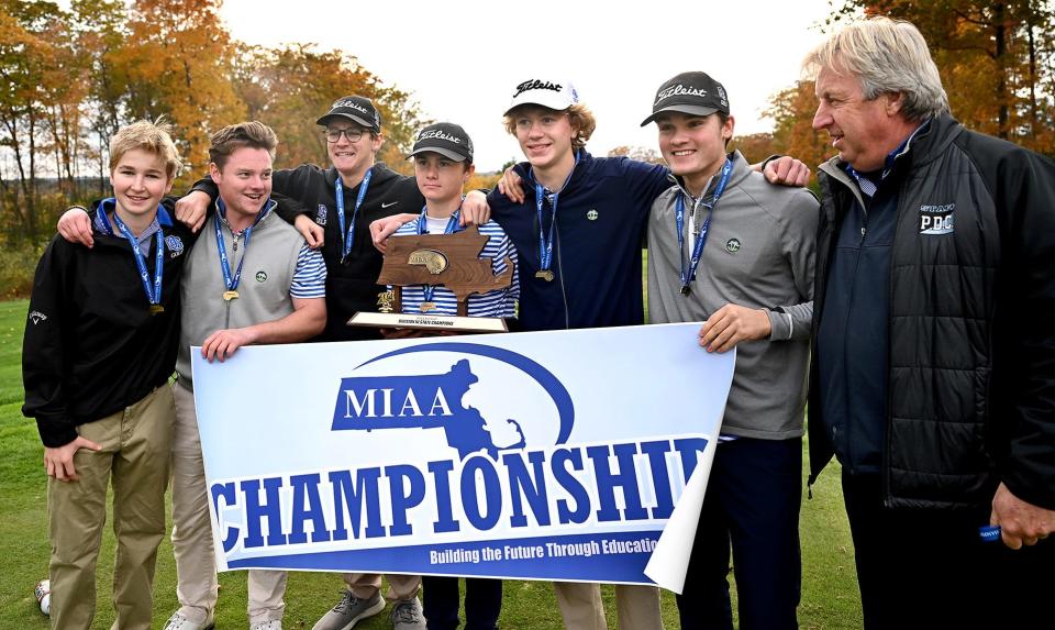 Owen Bingham (second from left) celebrates the Dover-Sherborn Regional High School golf team’s MIAA Division 3 state championship win at Shining Rock Golf Club in Northbridge, Massachusetts, Nov. 2, 2021.