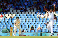 Australia's captain Michael Clarke, left, watches as South Africa's bowler Vernon Philander, right, unsuccessfully appeals for LBW against him on the first day of their their cricket Test match at Centurion Park in Pretoria, South Africa, Wednesday, Feb. 12, 2014. (AP Photo/ Themba Hadebe)