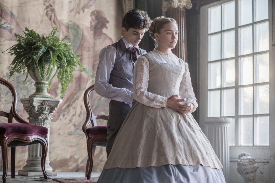 Amy March (Florence Pugh) gets a hand from childhood friend Laurie (Timothee Chalamet) in "Little Women."