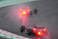 Red Bull driver Max Verstappen of the Netherlands leads Ferrari driver Charles Leclerc of Monaco during the Japanese Formula One Grand Prix at the Suzuka Circuit in Suzuka, central Japan, Sunday, Oct. 9, 2022. (AP Photo/Eugene Hoshiko)
