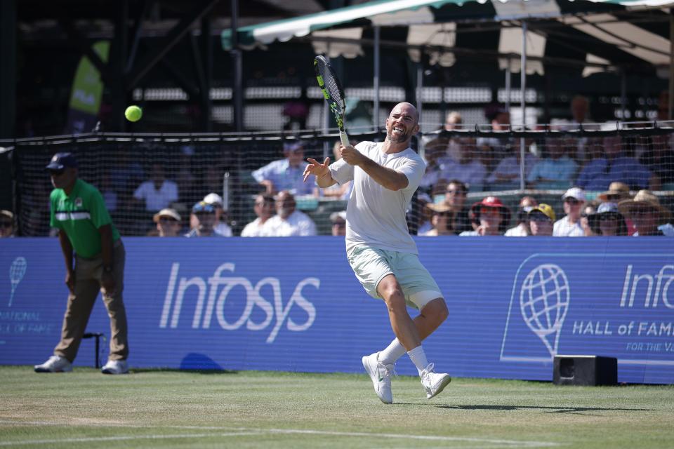 Adrian Mannarino volleys during his match on Sunday in the Infosys Hall of Fame Open in Newport.