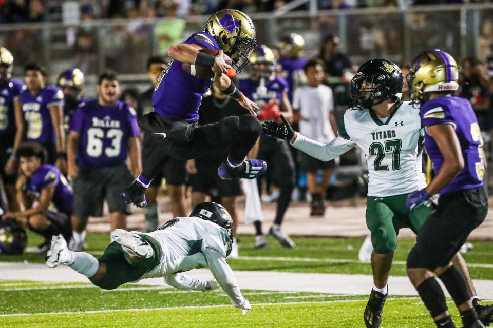 Miller’s Jaedyn Brown vaults over San Antonio Southwest Legacy’s Nate Ibarra during the Class 5A Division I bi-district game at Cabaniss Stadium, Thursday, Nov. 10, 2022, in Corpus Christi, Texas.