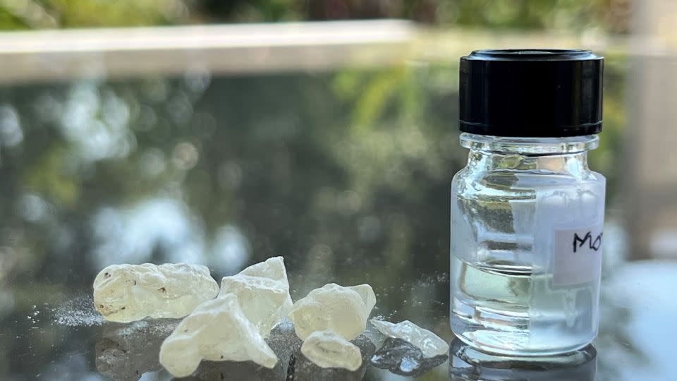 Dammar resin, an ingredient used in embalming, appears next to a bottle of the recreated ancient scent. - Barbara Huber