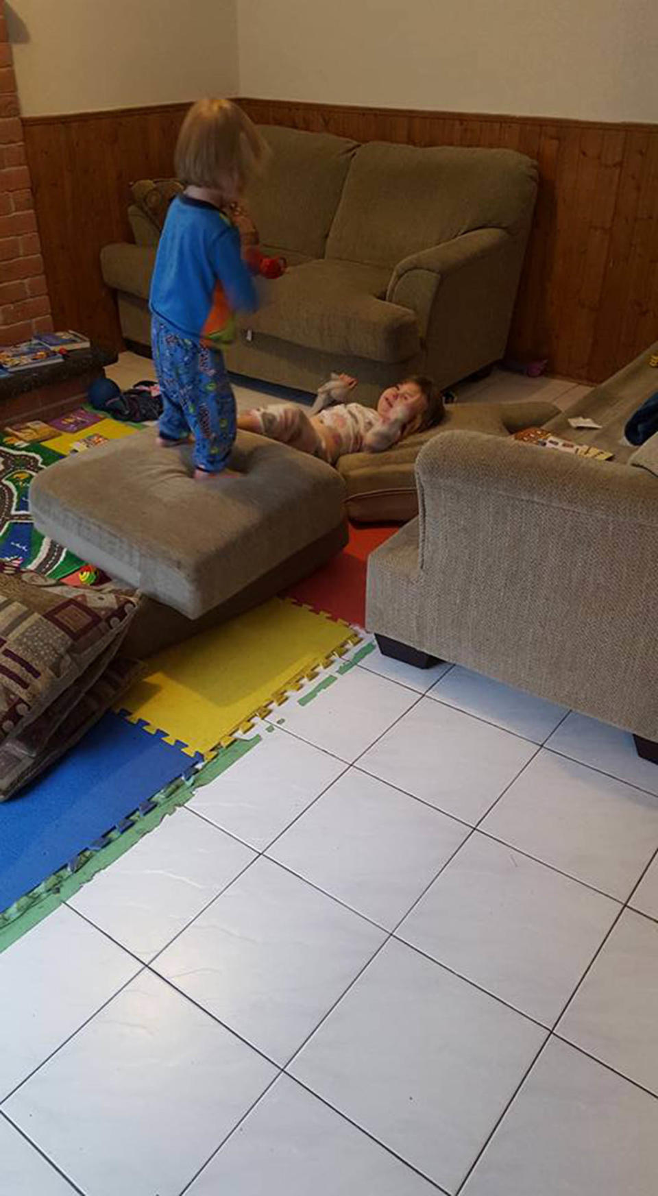 My kids flipping off the couch cushions to make a "castle" while I make breakfast and pack school lunches.