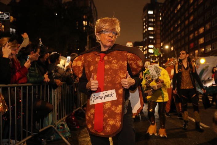 A woman wears a Trump is Toast costume during the Halloween Parade in New York. (Photo: Gordon Donovan/Yahoo News)