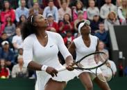 <p>Serena Williams, left, and her sister Venus of the U.S watch the ball during their women’s doubles match against Andreja Klepac and Katarina Srebotnik of Slovenia on day four of the Wimbledon Tennis Championships in London, Thursday, June 30, 2016. (AP Photo/Tim Ireland)</p>