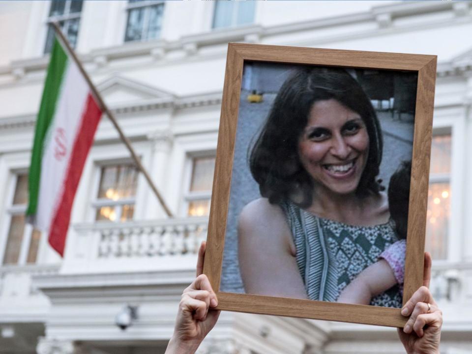 Supporters hold a photo of Nazanin Zaghari-Ratcliffe during a vigil (Getty)