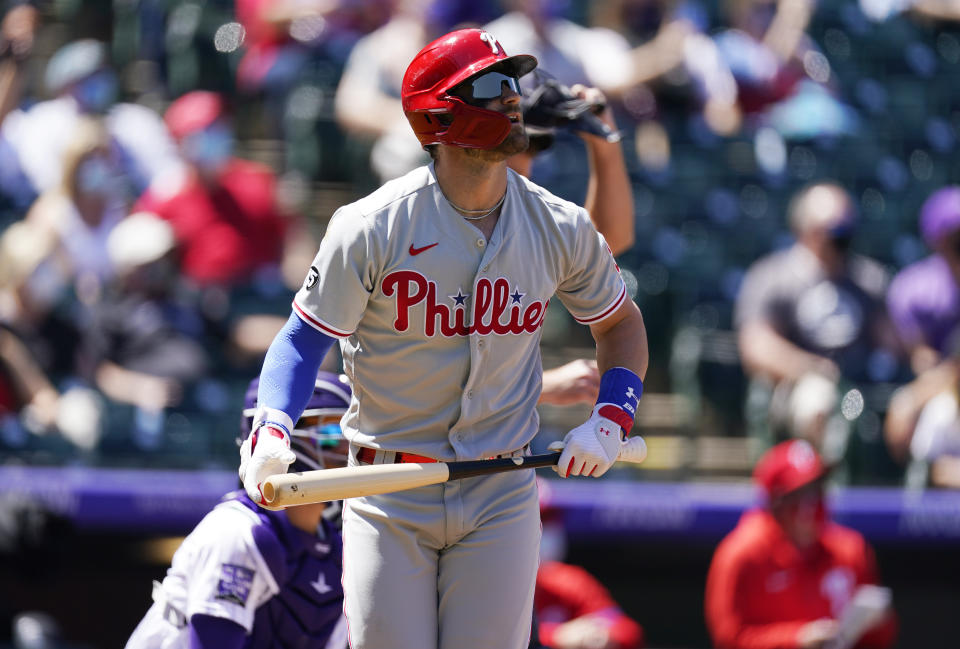 Philadelphia Phillies' Bryce Harper heads up the first base line after hitting a solo home run off Colorado Rockies starting pitcher Jon Gray in the first inning of a baseball game Sunday, April 25, 2021, in Denver. (AP Photo/David Zalubowski)
