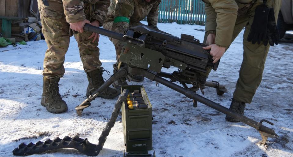 Special forces soldiers from Ukraine's "Signum" unit demonstrate the use of an American-made MK-19 grenade launcher in Ukraine's Donbas region on Feb. 11, 2023.
