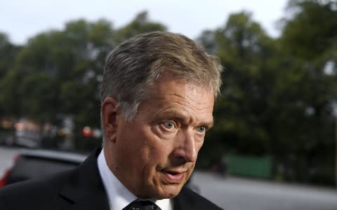 President of Finland Sauli Niinist arrives for a prayer service for stabbing victims at the Cathedral in Turku on Friday - Credit: Vesa Moilanen/Lehtikuva via AP