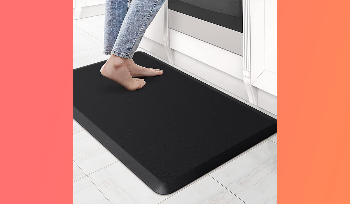 Person standing on fatigue mat in kitchen.