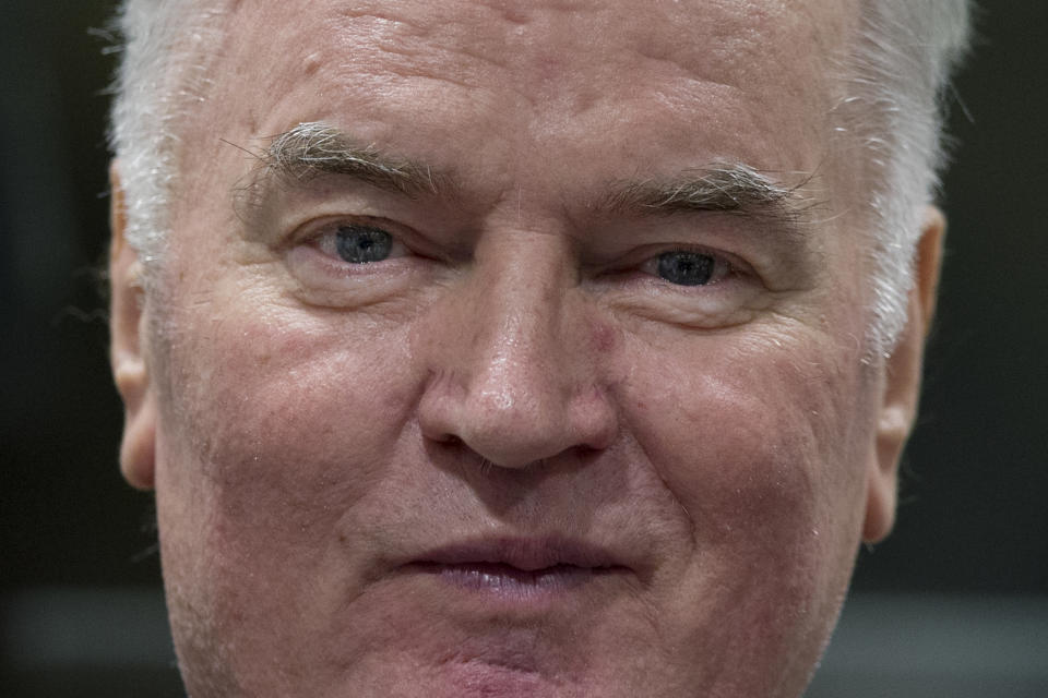 FILE - In this Wednesday, Nov. 22, 2017 file photo, Bosnian Serb military chief Ratko Mladic enters the Yugoslav War Crimes Tribunal in The Hague, Netherlands, to hear the verdict in his genocide trial. Mladic is appealing Tuesday, Aug. 25, 2020 against his convictions for crimes including genocide committed throughout the 1992-95 Bosnian War. Mladic was convicted by a U.N. war crimes tribunal in 2017 and sentenced to life imprisonment for masterminding crimes by Bosnian Serb forces throughout the war that left 100,000 dead, an overwhelming majority of them Bosnian Muslim civilians. (AP Photo/Peter Dejong, Pool, File)