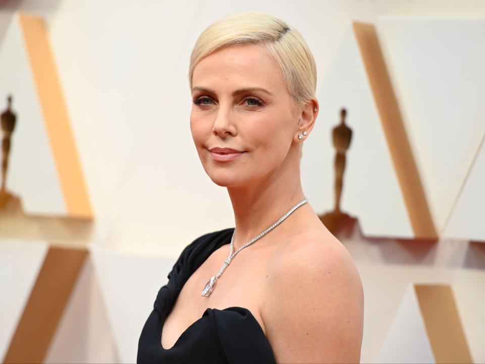 Charlize Theron arrives for the 92nd Oscars at the Dolby Theatre in Hollywood, California on 9 February 2020 (ROBYN BECK/AFP via Getty Images)