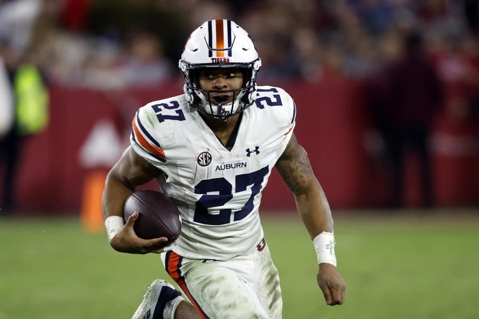 FILE - Auburn running back Jarquez Hunter (27) carries the ball against Alabama during the second half of an NCAA college football game Saturday, Nov. 26, 2022, in Tuscaloosa, Ala. Auburn opens their season at home against UMass on Sept. 2.(AP Photo/Butch Dill, File)