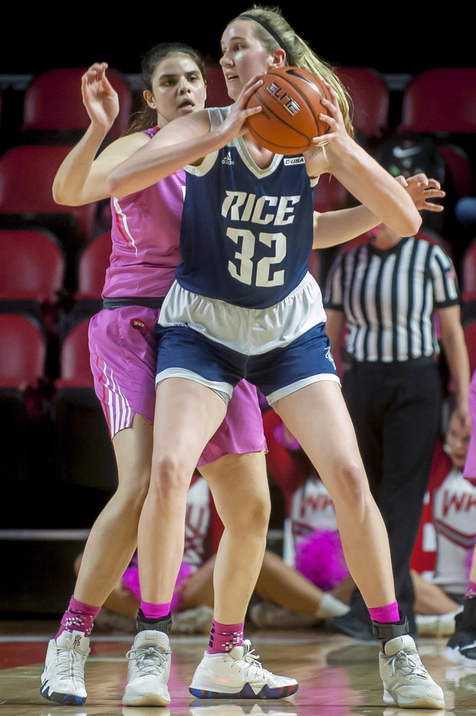 FILE - In this Feb. 7, 2019, file photo, Rice center Nancy Mulkey posts up against Western Kentucky forward Raneem Elgedawy during a women's NCAA college basketball game in Bowling Green, Ky. Buoyed by the second-longest winning streak in the country, Rice has entered The Associated Press women’s basketball poll for the first time in school history. The Owls have won 15 straight games and are ranked 25th in Monday’s poll. (Bac Totrong/Daily News via AP, File)