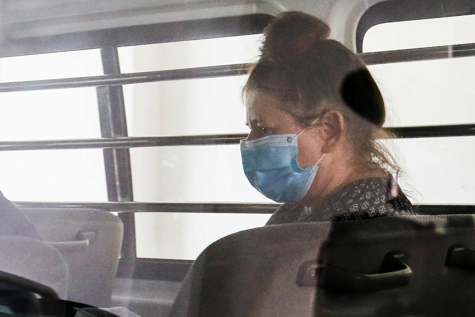 British national Samantha Jones, accused of killing her husband in 2018, is escorted by a police officer in a van after appearing in court in Alor Setar, in northern Malaysia, on August 3, 2020. - A British woman was jailed for three and a half years on August 3, after tearfully admitting she stabbed her husband to death during a fight on the Malaysian holiday island of Langkawi. (Photo by A. Ammarudin / AFP) (Photo by A. AMMARUDIN/AFP via Getty Images)