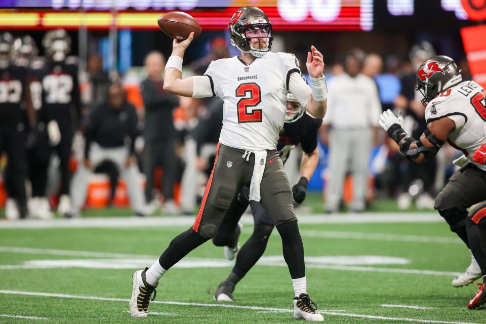 Tampa Bay Buccaneers quarterback Kyle Trask (2) throws a pass against the Atlanta Falcons in the second half at Mercedes-Benz Stadium.