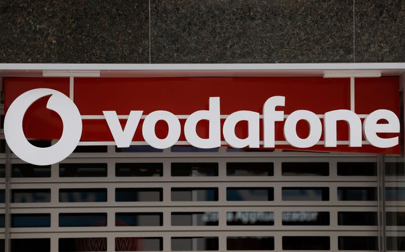 The logo of Vodafone is seen on the facade of a store in Ronda