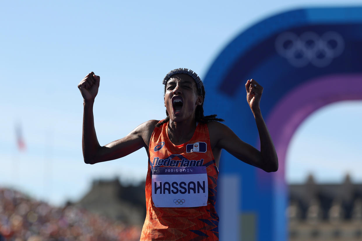 Hassan set an Olympic record in a thrilling women's marathon that came down to a sprint. (Cameron Spencer/Getty Images)