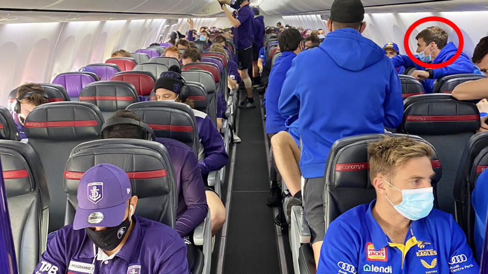 West Coast's Jamie Cripps, circled, wasn't wearing his mask correctly on a flight to Victoria.