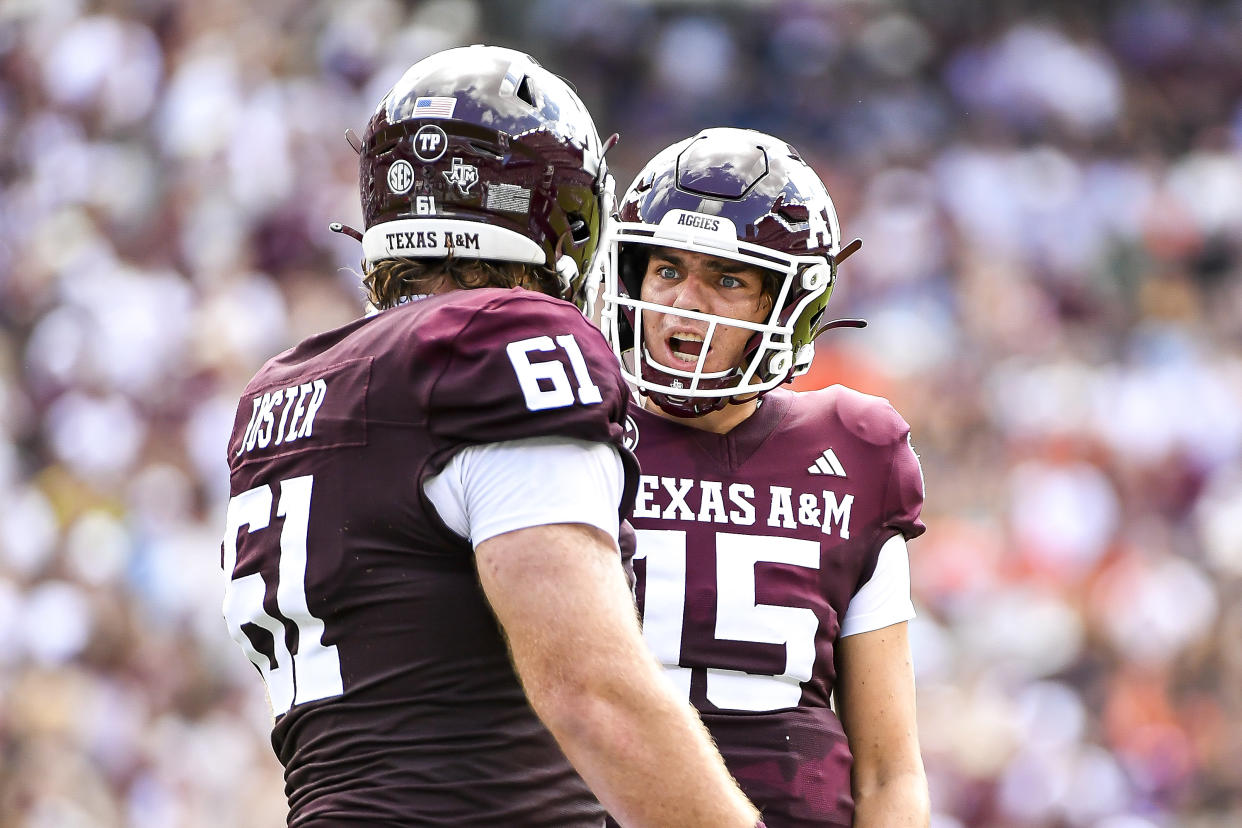 COLLEGE STATION, TEXAS - SEPTEMBER 23: Quarterback Conner Weigman #15 yells at offensive lineman Bryce Foster #61 of the Texas A&M Aggies during the first half against the Auburn Tigers at Kyle Field on September 23, 2023 in College Station, Texas. (Photo by Logan Riely/Getty Images)