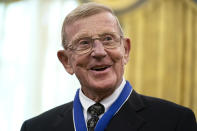 Former football coach Lou Holtz smiles after receiving the Presidential Medal of Freedom from President Donald Trump, in the Oval Office of the White House, Thursday, Dec. 3, 2020, in Washington. (AP Photo/Evan Vucci)