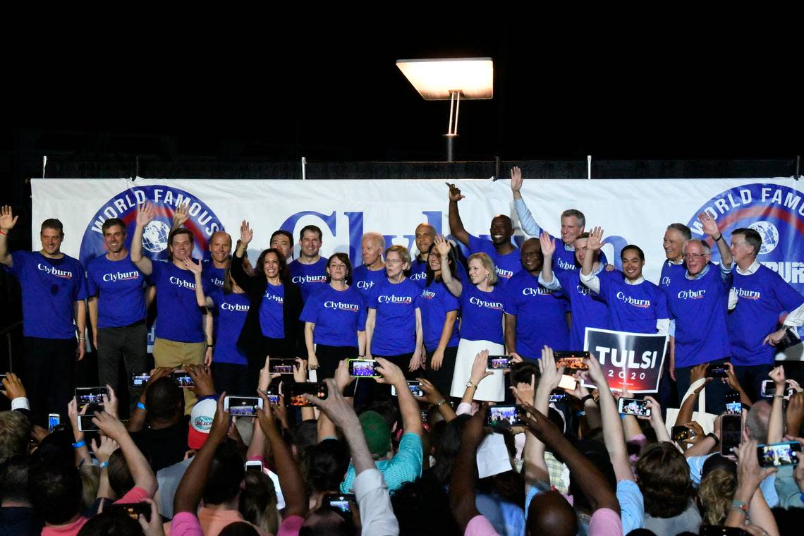 Twenty-one of the Democrats seeking the party’s presidential nomination pose together after House Majority Whip Jim Clyburn’s “World Famous Fish Fry,” Friday, June 21, 2019, in Columbia, S.C. (AP Photo/Meg Kinnard)