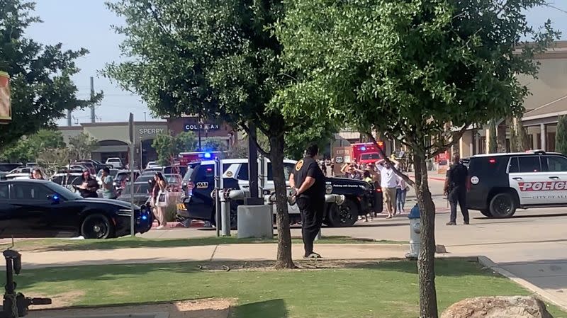 People exit Allen Premium Mall after shooting, in Allen