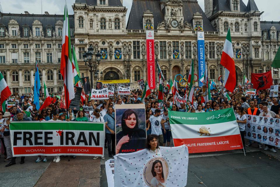 Demonstrators attend a protest against the Iranian regime in front of the Hotel de Ville in Paris on September 16, 2023, on the first anniversary of the death of Mahsa Amini in Iran.