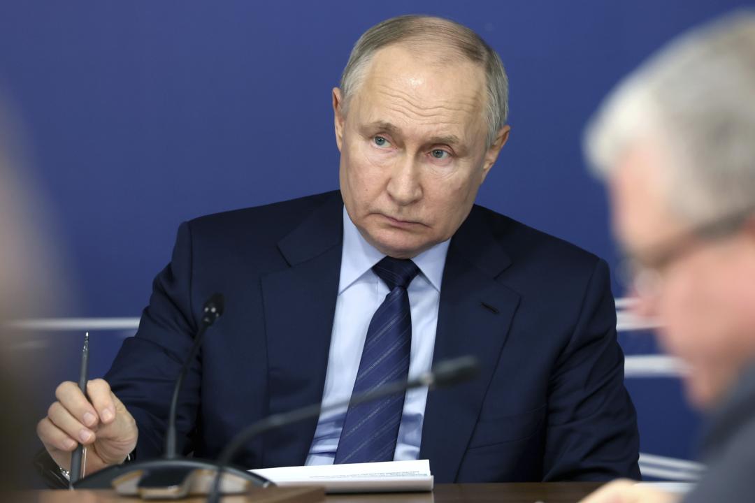 Russian President Vladimir Putin attends a meeting on the implementation of the high speed railway service linking Moscow with St. Petersburg construction project in the town of Verkhnyaya Pyshma, Sverdlovsk region, Russia, Thursday, Feb. 15, 2024. (Alexander Ryumin, Sputnik, Kremlin Pool Photo via AP)