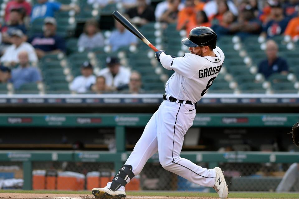 Tigers right fielder Robbie Grossman hits a double off Cleveland pitcher Zach Plesac in the first inning on Friday, Aug. 13, 2021, at Comerica Park.
