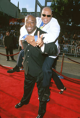 Michael Clarke Duncan gives fellow cool guy Ving Rhames a piggy-back ride at The Chinese Theater premiere of Paramount's Mission Impossible 2