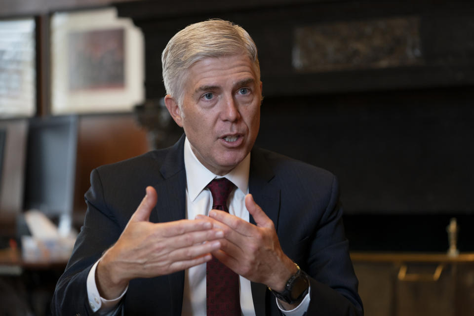 FILE - In this Sept. 4, 2019 file photo, Justice Neil Gorsuch, speaks during an interview in his chambers at the Supreme Court in Washington. Gorsuch on Friday, Sept. 20, said the conventional wisdom that the court is split along partisan lines based on the political views of the president that appointed each justice is false. Gorsuch spoke about civility at Brigham Young University refuting the notion that judges are just "like politicians with robes." (AP Photo/J. Scott Applewhite, File)