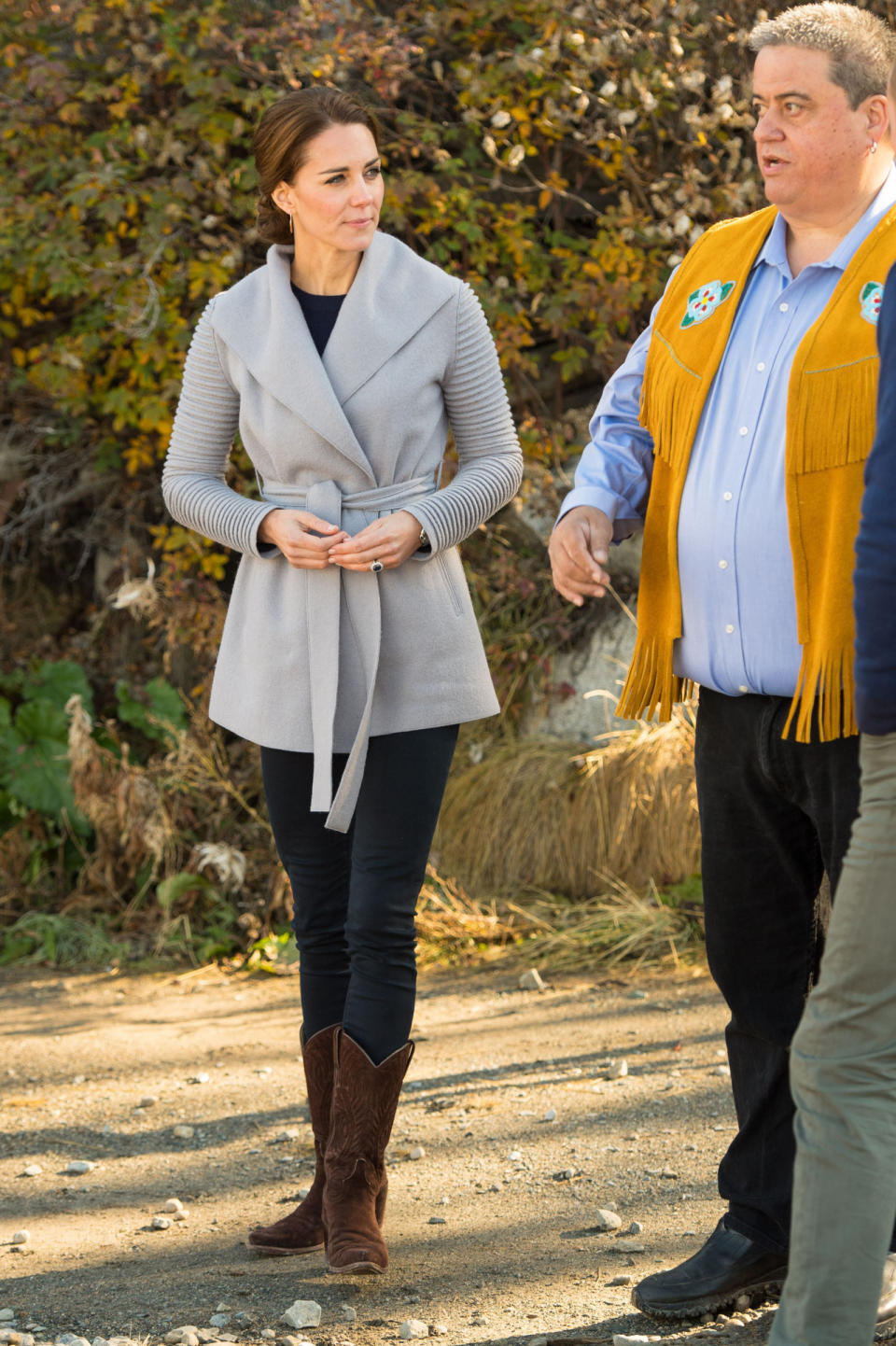 <p>Kate visited a small Canadian community, suitably choosing a grey wrap coat by Canadian brand, Sentaler. She paired the jacket with sensible brown cowboy boots and skinny jeans.</p><p><i>[Photo: PA]</i> </p>