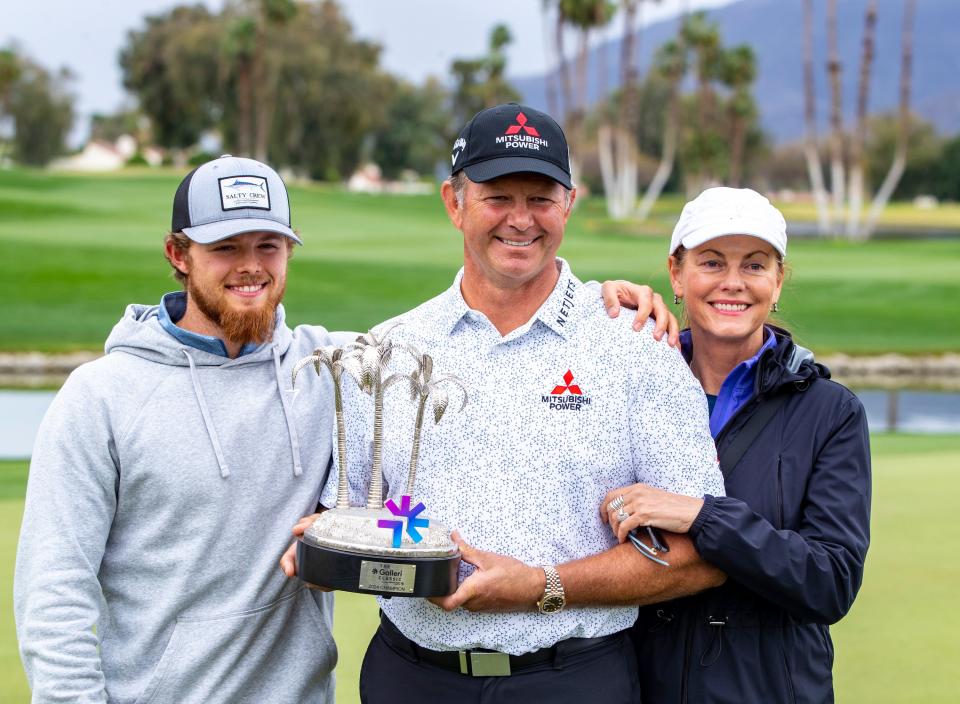 Retief Goosen poses for a photo with his son, Leo, and wife, Tracy, after winning the final round of The Galleri Classic at Mission Hills Country Club in Rancho Mirage, Calif., Sunday, March 31, 2024.