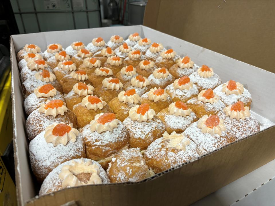 Dozens of orange cream paczki from New Palace Bakery in Hamtramck are used to make Detroit City Distillery's Orange Cream Paczki Day Vodka.