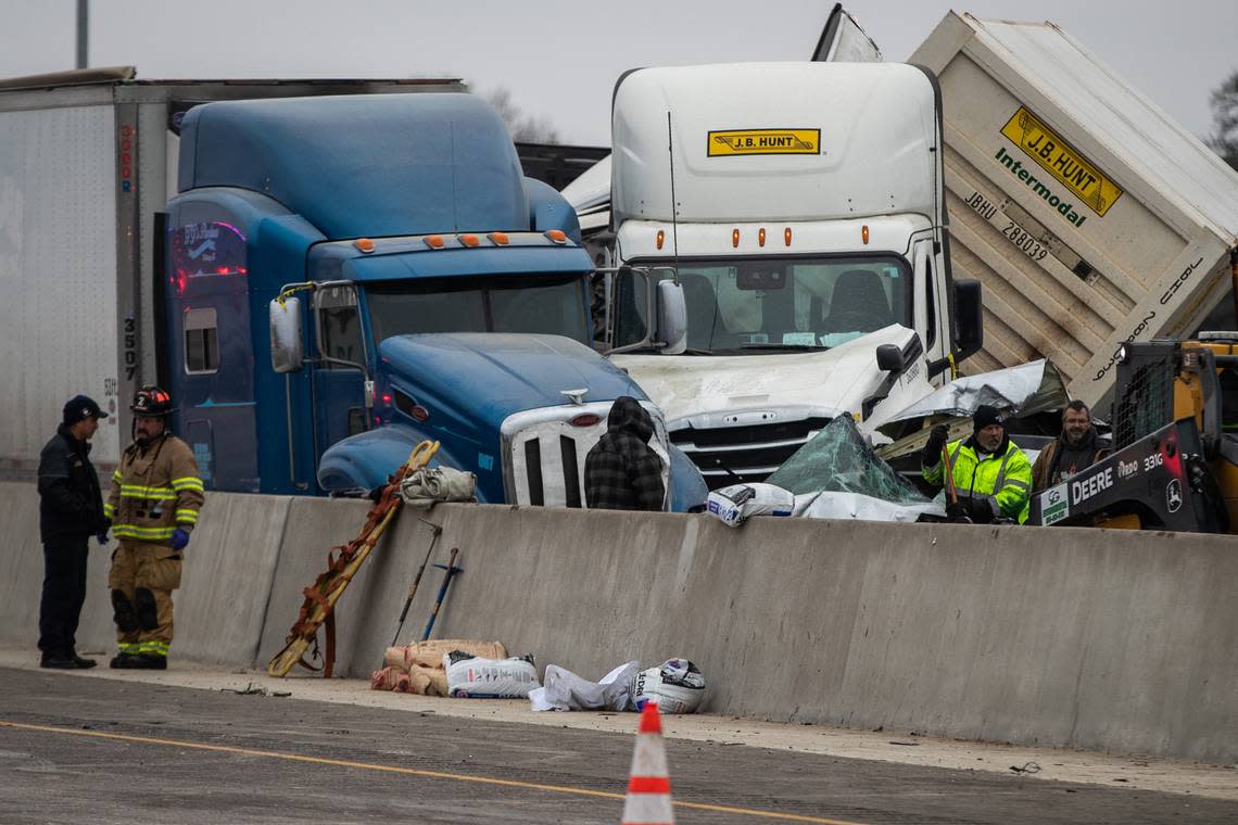 First responders cleanup after a massive pileup that killed six on I-35W Thursday, Feb. 11, 2021, near downtown Fort Worth.
