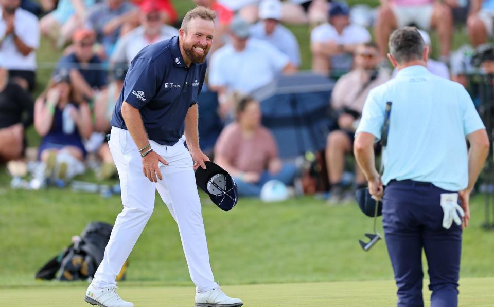 Lowry reacts after putting in to tie the Major Championship round record of 62 on the 18th green