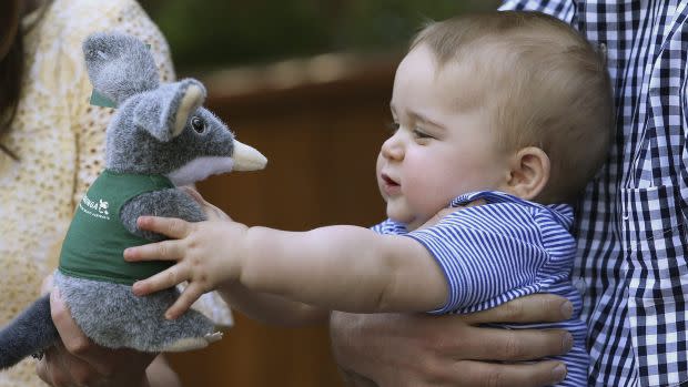 Britain's Prince George holds a toy Bilby during a visit to a zoo in Australia.